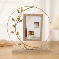 Cadre photo en cercle de fer en gros, base en bois avec feuilles noires, décoration bohème pour la maison, MOQ flexible, directement de l'usine