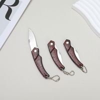 Petit couteau porte-clés portable pliant à grain de bois à manche rouge