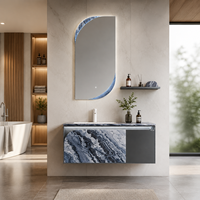 Meuble-lavabo suspendu minimaliste en acier inoxydable pour salle de bain avec miroir éclairé irrégulier