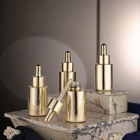Flacon compte-gouttes en or personnalisable de luxe 30 ml 1 oz pour soins de la peau, emballage en verre avec bouchon compte-gouttes doré avec revêtement UV