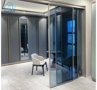 Porte pliante moderne à trois panneaux en aluminium noir ultra-mince avec verre transparent intégral pour salle à manger, villa et cloison de salon de thé