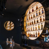 Nouveau design de comptoir de bar, armoire murale de présentation de vin tout-en-un, casier à vin circulaire lumineux à LED pour club et bar