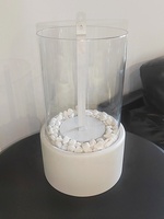 Cheminée bioéthanol au design moderne, autoportante, d'intérieur, ronde, avec plateau blanc en acier inoxydable
