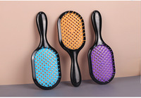 Brosse à cheveux démêlante imperméable pour femmes avec logo personnalisé, fonction de massage, poils en nylon, design rond - OEM/ODM disponible