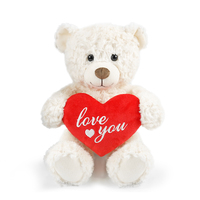 Un ours en peluche de haute qualité tenant un objet en forme de cœur pour exprimer l'amour.