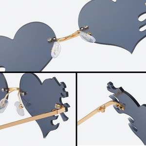 Lunettes de soleil de luxe pour femmes, style œil de chat, verres miroir, sans monture, en forme de cœur, pour une touche de personnalité - Product Image 4