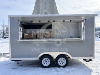 Remorque de camion-restaurant à double essieu gris mat personnalisée avec cuisine entièrement isolée pour la restauration d'événements hivernaux en plein air
