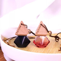Diffuseur d'arômes à vente chaude, mini flacon de parfum pour voiture en verre vide de 7 ml, diffuseur d'air avec couvercle en bois