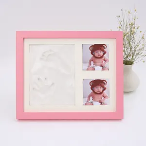 A Solid Wood Photo Frame With Hand And Foot Ink That Records The Growth Of A Century Old Baby In A Gift Box