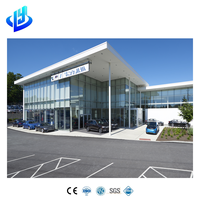 Concessionnaire de voitures préfabriquées en acier à construction rapide avec mur-rideau en verre, usine de service et espace de bureau client