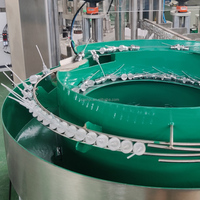 Machine de remplissage de parfum sous vide à pression négative, ligne de remplissage réduisant la formation de mousse et les gouttements