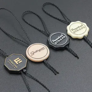 Customized Logo High End Brand Embossed Design Beauty Brand Clothing Plastic Seal Tag for Clothing Shoes Hats
