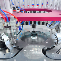 Ligne de remplissage électrique automatique WJER-80 BOV contrôlée par PLC pour applications chimiques et cosmétiques avec têtes de nettoyage de soupapes