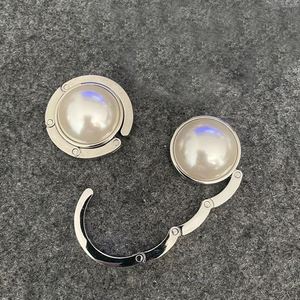 Porte-sac de table rond de luxe en fer plaqué argent avec perles et impression sérigraphiée, design moderne, pour cadeaux féminins - Product Image 2