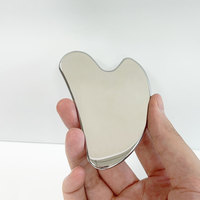 أداة رفع الوجه Gua Sha من الفولاذ المقاوم للصدأ ، لوح تدليك عالي الجودة مضاد للشيخوخة وتفتيح الوجه للاستخدام المنزلي بشعار مخصص