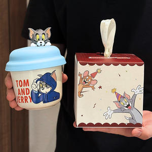 Taza de cerámica de Tom y Jerry con tapa, diseño de dibujos animados azul, para uso doméstico o como regalo. - Product Image 1