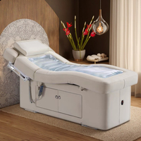 Table de massage électrique moderne personnalisée avec revêtement en cuir PU et fonction chauffante pour les soins de spa en hôtel