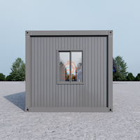 Bureau conteneur à façade vitrée complète avec cadre gris, fenêtres à auvent et porte coulissante double en verre
