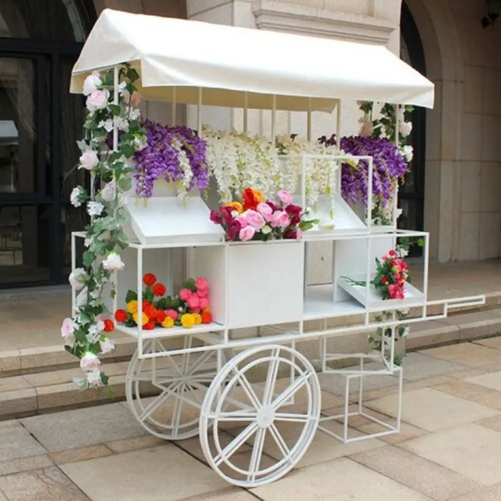 Suministros para fiestas de boda, carrito de dulces blancos de Metal, carrito de flores para bodas, decoraciones, diseño de carrito de exhibición de flores para venta de eventos
