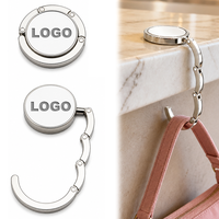 Support de sac pliable en alliage de zinc pour table, crochet porte-clés portable sans perçage, support de sac à main personnalisable avec logo, accroche-sac de table