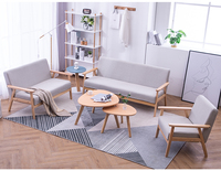 Le style japonais d'OEM conçoit le fauteuil tapissé de bois de tissu pour le salon avec la chaise de sofa de jambes en bois solide