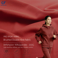 Fabricant fournissant des tissus en polaire de qualité supérieure avec élasthanne pour une grande élasticité, destinés aux vêtements de sport chauds pour femmes.