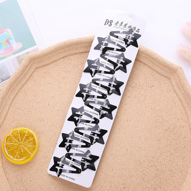 Étoile à cinq branches point noir sable