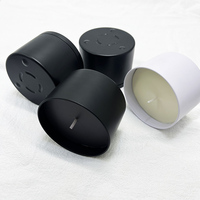 Caisse noire mate ronde de bidon de cylindre fait sur commande avec 3 pieds de points et surface sans couture