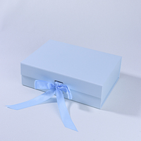 Boîte cadeau rigide pliable bleue sur mesure pour économiser de l'espace avec fermeture magnétique et ruban de fermeture