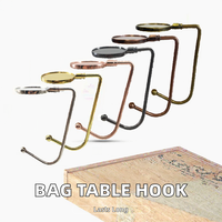 Crochet de sac de haute qualité, instantané, portable, à poser sur la table, support de sac, meilleur prix, pièces de sac personnalisées, accessoires spéciaux