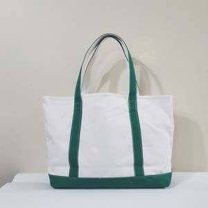 กระเป๋าผ้าแคนวาสสำหรับผู้หญิงพร้อมหูหิ้วเชือก ปิดด้วยซิป ดีไซน์สวยงาม พกพาสะดวกและซักล้างได้ เหมาะสำหรับซื้อของชำและให้เป็นของขวัญ - Product Image 1