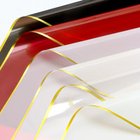 Papier d'emballage translucide imperméable DLBZ, feuille de papier d'emballage floral enduit de PVC avec bord doré pour emballer des cadeaux floraux