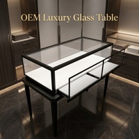 Comptoir de présentation de bijoux de luxe en acier inoxydable noir avec dessus en verre, éclairage LED, vitrine d'exposition verrouillable pour montres