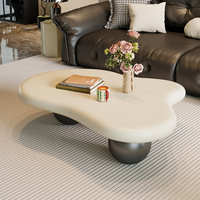Table Basse Nuage Nordique Minimaliste et Luxueuse Crème Blanc Unique et Élégante avec Piétement Sphérique Noir