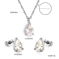 Ensemble de collier et boucles d'oreilles en acier inoxydable avec nœud papillon et zircon pour femmes, ensemble de bijoux tendance en forme de cœur transparent