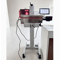 Machine de codage de date d'expiration de lot Machine de marquage laser CO2 à grande vitesse Imprimante alimentaire pour bouteilles en PET Ligne de remplissage d'eau