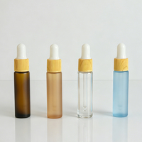 Supplier Grosir Botol Tetes Kaca Amber Buram dengan Tutup Cetak Motif Kayu Anti Jamur untuk Kemasan Minyak Atsiri Kustom
