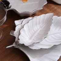 Porte-bijoux en céramique à bord doré nordique créatif européen Vente chaude Plateau en forme de feuille de palmier Mariages Plats de fête des mères