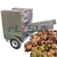 Machine efficace de décorticage de noix de coco Chaîne de production de traitement d'élimination de coquille de noix de coco Équipement d'épluchage de noix de coco