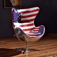 Fauteuil lounge pivotant en cuir Spitfire, design italien classique, avec dossier en aluminium, pour salon.