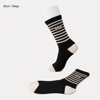 Chaussettes mi-mollet en jacquard de coton mélangé haute élasticité, idéales pour le printemps, le fitness quotidien, le jogging, antibactériennes, avec logo sur le bord.