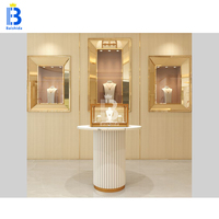 Vitrine de présentation de bijoux circulaire de luxe en or rose sur mesure avec éclairage LED pour boutique de bijoux, kiosque