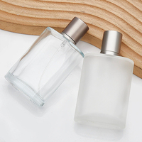 Flacon vaporisateur en verre transparent avec logo et étiquettes personnalisés, atomiseur de parfum 30ml 50ml 100ml, flacon de parfum en verre pour marque de luxe