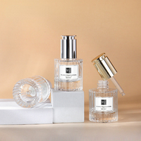 Flacon compte-gouttes à pompe fantaisie de luxe de 30ml bouteille en verre d'huile essentielle d'essence à fond épais 1oz bouteille vide en verre cosmétique givré