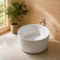 Baignoire autoportante à surface ronde, bain cylindrique compact en pierre blanche pour petites salles de bain et centres de spa, design moderne et élégant