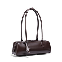 Vente en gros usine : Sac de mode tendance, sac à longue anse, sac rétro de niche, sac porté épaule, sac à main pour femme, sac coussin