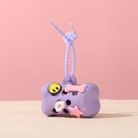 Distributeur portable de sacs à déjections pour animaux de compagnie, en silicone souple, en forme d'os de dessin animé, étui de rangement pour sacs à déjections canines pour les promenades quotidiennes avec le chien