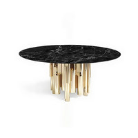 Table à manger italienne de luxe en marbre avec un dessus rotatif et une base en métal irrégulière adaptée au salon