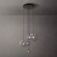 Lustre moderne en acier inoxydable avec globe en verre transparent pour salon, escalier, hôtel, décoration