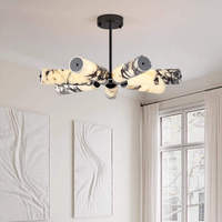 Lampe suspendue moderne en résine avec abat-jour cylindriques à motif marbré, cadre en métal noir pour éclairage de plafond de salon
